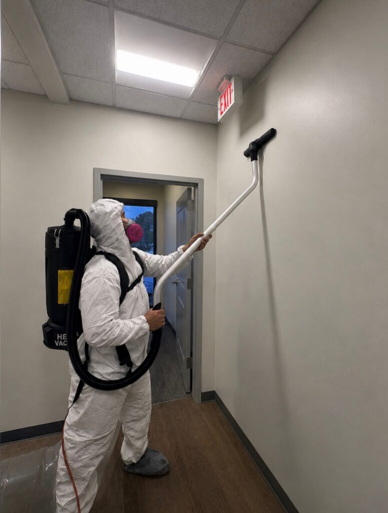 Sapphire Restoration technician HEPA vacuuming during mold remediation